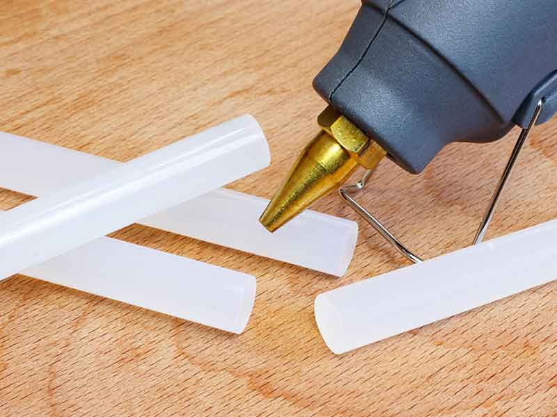 Hot glue gun and hot glue bars.
