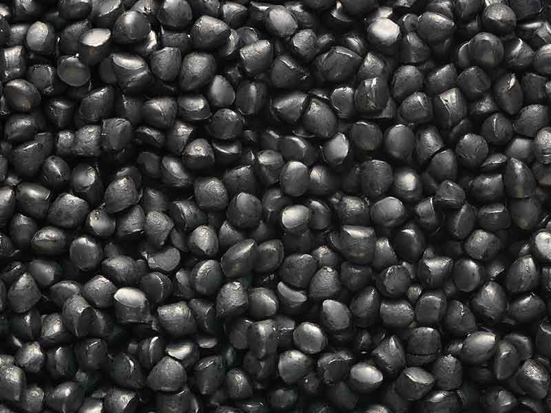 Black granules of reinforced compounds.