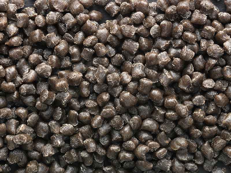 Black raw mass granules of natural fiber composites compounding systems by BUSS.